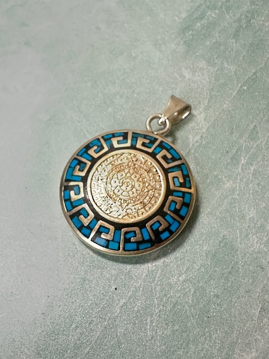 Vintage Jewelry - sterling silver pendant Mexican-made piece turquoise inlay Aztec calendar
